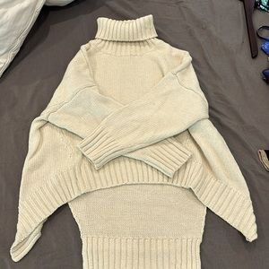 Cream turtle neck sweater.